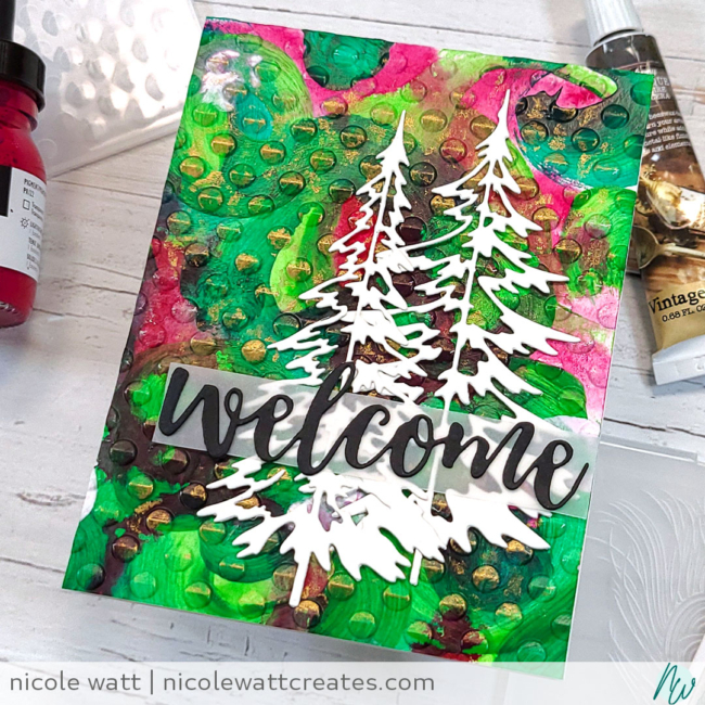 greeting card featuring Playful Circles embossing folder by Altenew, Woodlands dies by Tim Holtz, Prima Metallique wax, and Liquitex acrylics, by Nicole Watt - Nicole Watt Creates (nicolewattcreates.com)